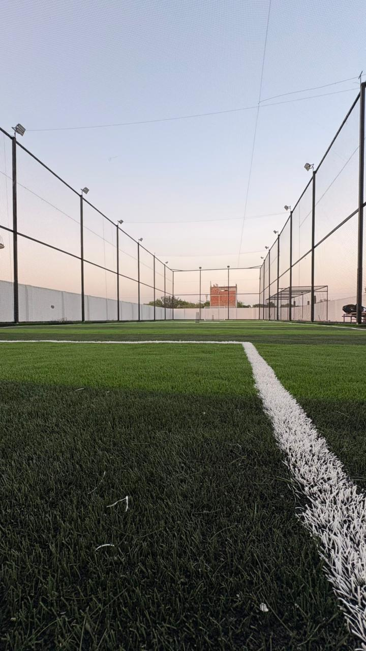 Floodlit turf arena at night
